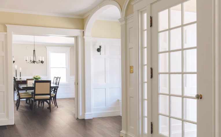 maple hardwood in foyer with curved archway